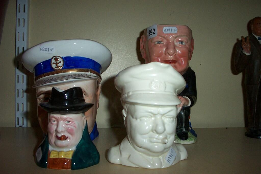 Appraisal: A collection of four character and Toby jugs in the