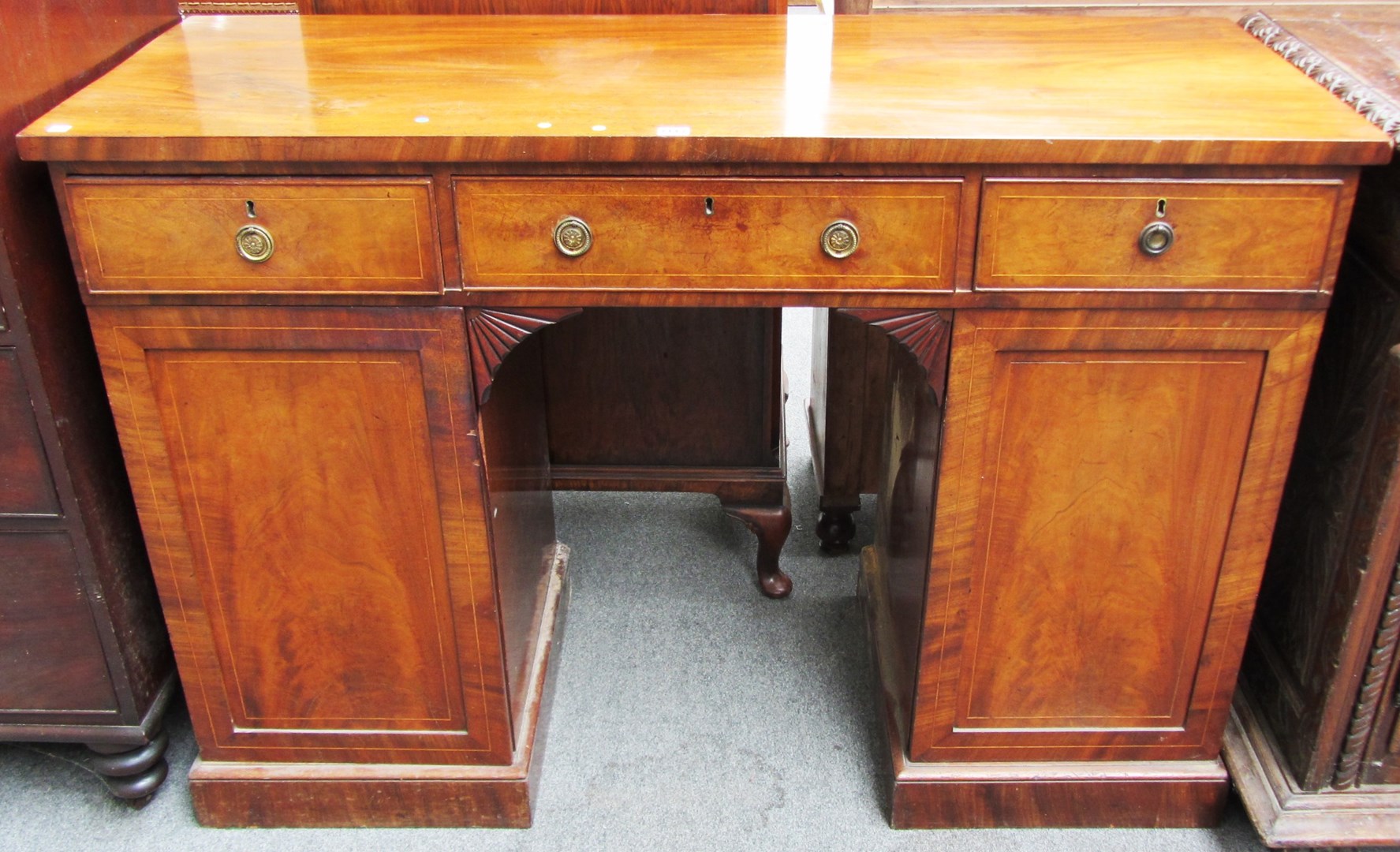 Appraisal: An early th century inlaid mahogany sideboard with three frieze