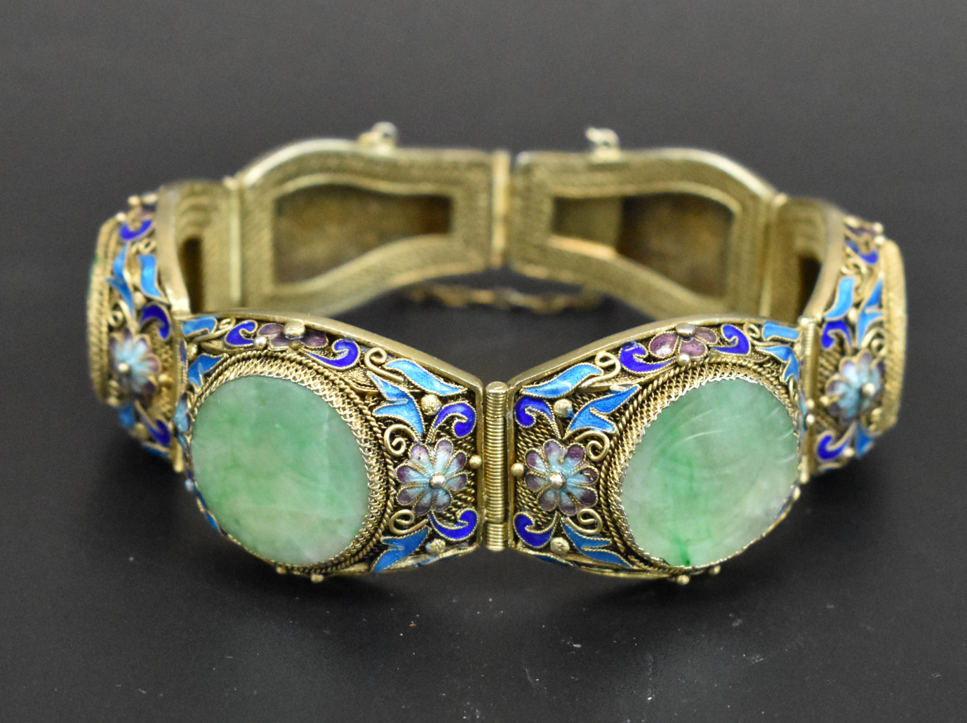 Appraisal: A enameled blue and jadeite bracelet Bracelet is formed with