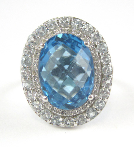 Appraisal: BLUE TOPAZ AND FOURTEEN KARAT WHITE GOLD RING with round-cut