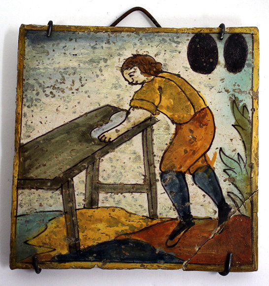 Appraisal: A TH CENTURY TIN GLAZED TILE depicting a workman at