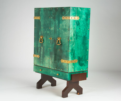 Appraisal: ALDO TURA Fine two-door bar cabinet with dyed-green parchment covering