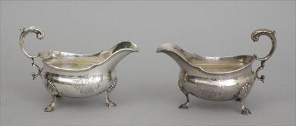 Appraisal: PAIR OF VICTORIAN ARMORIAL SILVER TRIPOD SAUCE BOATS E J