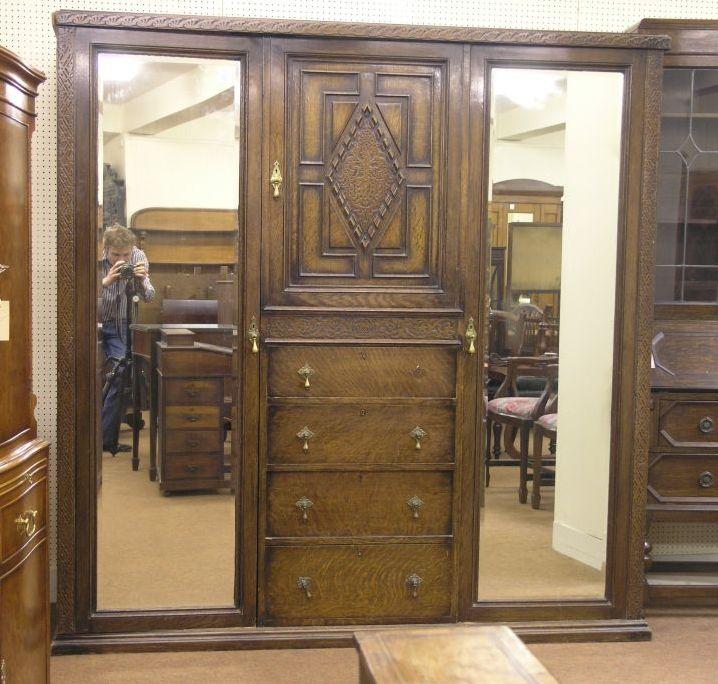 Appraisal: A Jacobean style solid oak wardrobe having a pair of