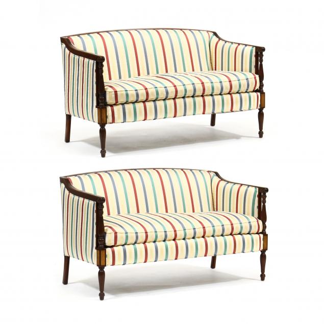 Appraisal: PAIR OF SHERATON STYLE UPHOLSTERED SETTEES Likely Southwood striped silk