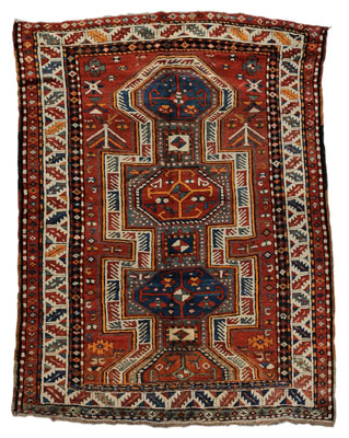 Appraisal: Kazak Rug Caucasian three-and-a-half connected central medallions on brick-red ground