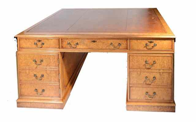 Appraisal: A MODERN WALNUT PEDESTAL PARTNERS DESK with brown leather inset