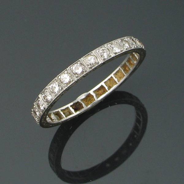 Appraisal: A diamond and platinum eternity band estimated total diamond weight