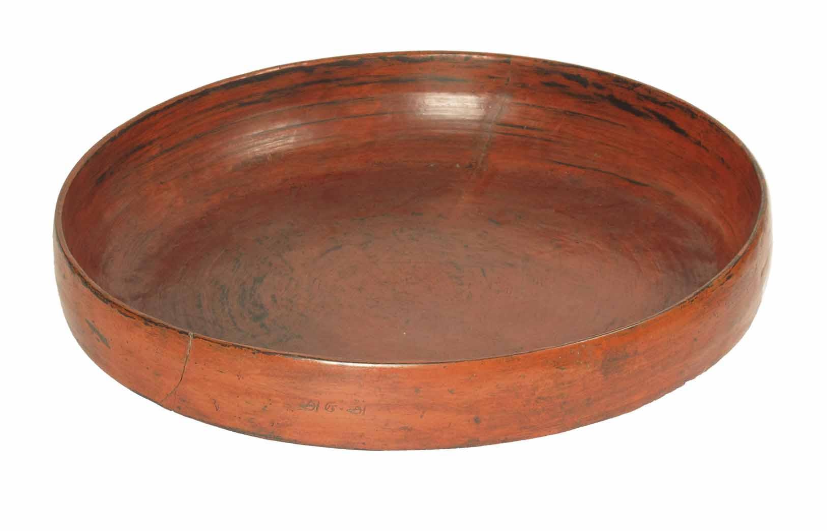 Appraisal: A large oriental circular red lacquered wood feast bowl