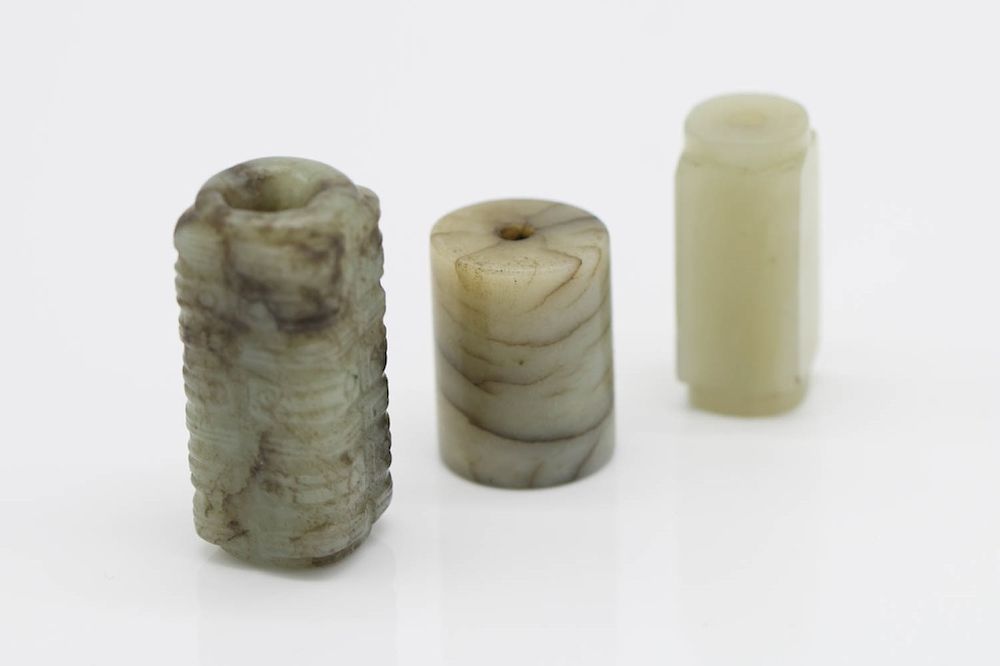 Appraisal: THREE JADE OBJECTS One cong one smaller cong one cylindrical