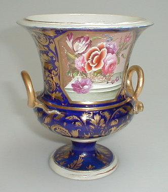 Appraisal: An early thC Derby porcelain campana urn with painted reserve