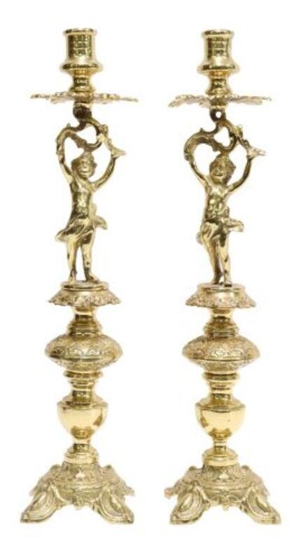 Appraisal: pair Continental gilt-metal putti single-light candlesticks th c foliate bobeche