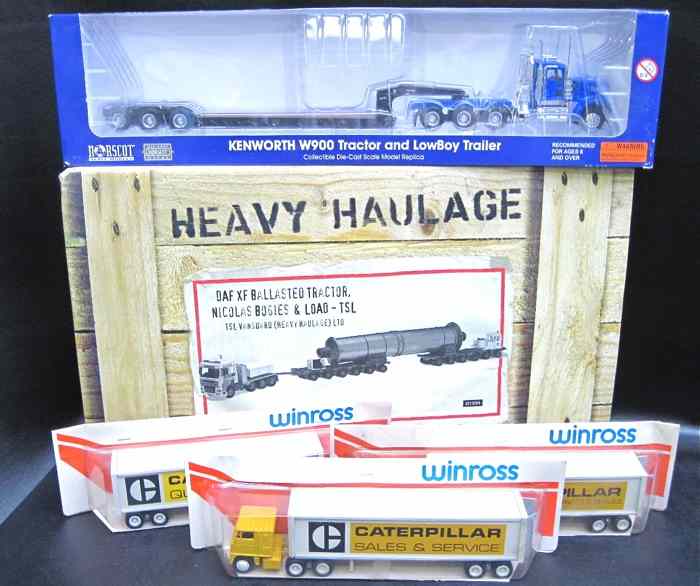 Appraisal: FIVE DIECAST MODEL TRUCKS WITH TRAILERS Corgi ''Heavy Haulage DAF