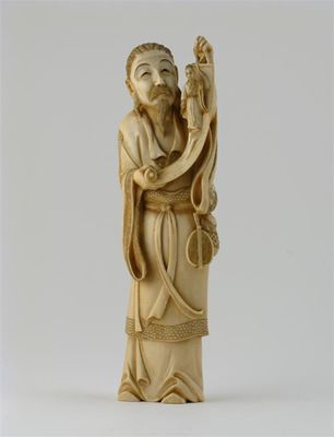 Appraisal: A Japanese ivory carving of a standing figure holding a