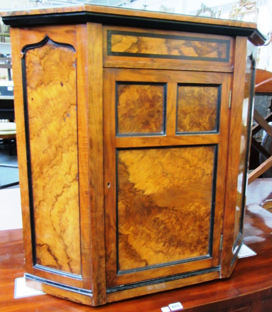 Appraisal: A th century figured walnut hanging corner cupboard cm wide