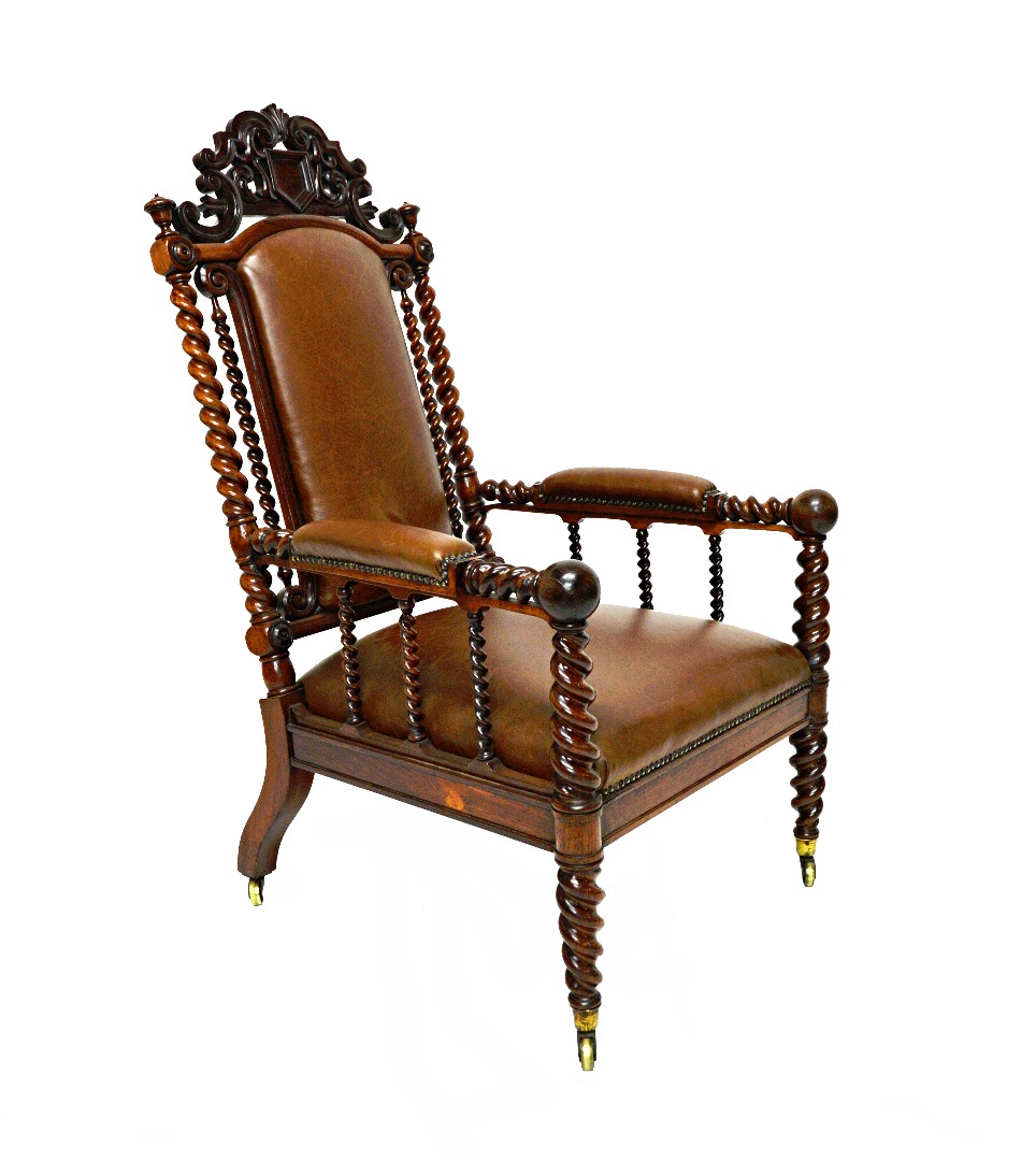 Appraisal: A Victorian rosewood framed semi-padded open arm easy chair with