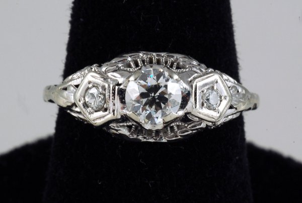 Appraisal: White gold ring stamped K Center diamond prong set and