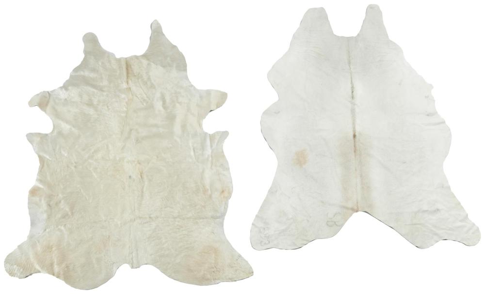 Appraisal: A pair of cowhide rugs st Century One with stamped