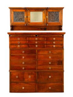 Appraisal: Twenty American th century A multi-drawer stained oak dental cabinet