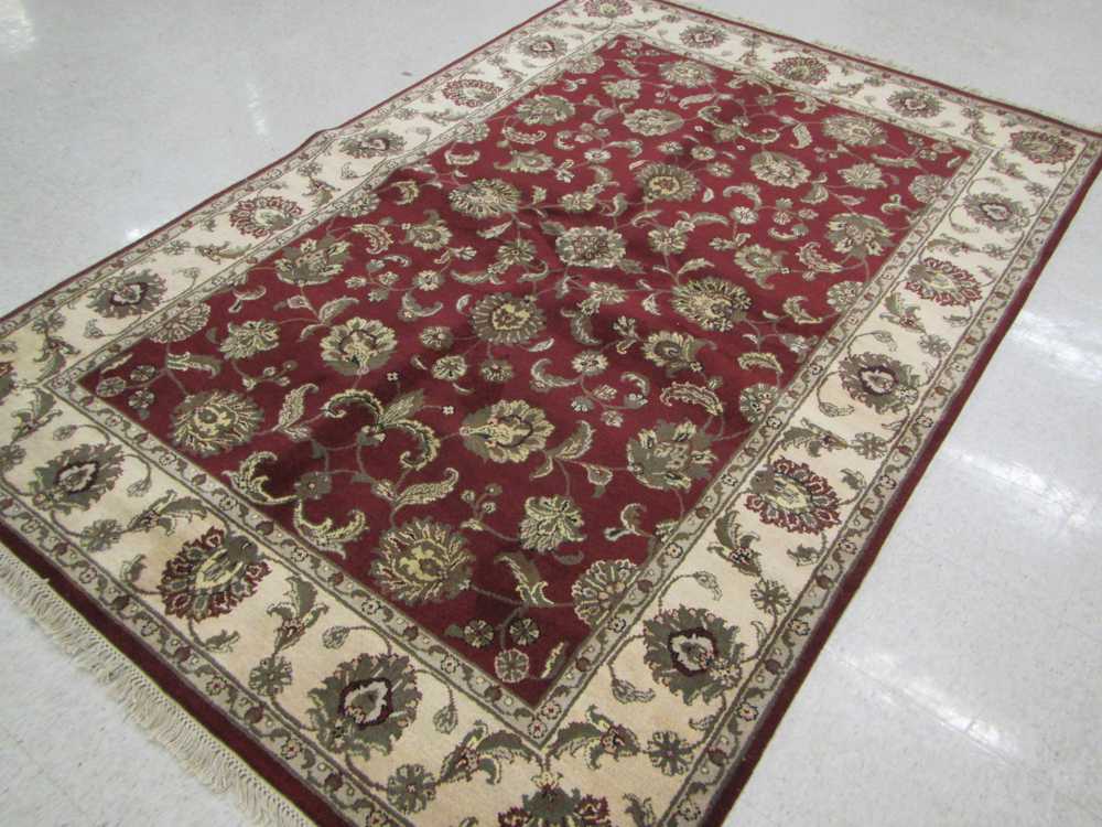 Appraisal: HAND KNOTTED ORIENTAL CARPET Indo-Persian overall floral design on rectangular