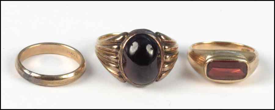 Appraisal: GARNET AND KARAT YELLOW GOLD RING Together with two rings