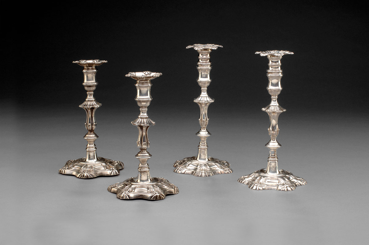 Appraisal: PAIR OF GEORGE II SILVER CRESTED CANDLESTICKS JOHN CAFE LONDON