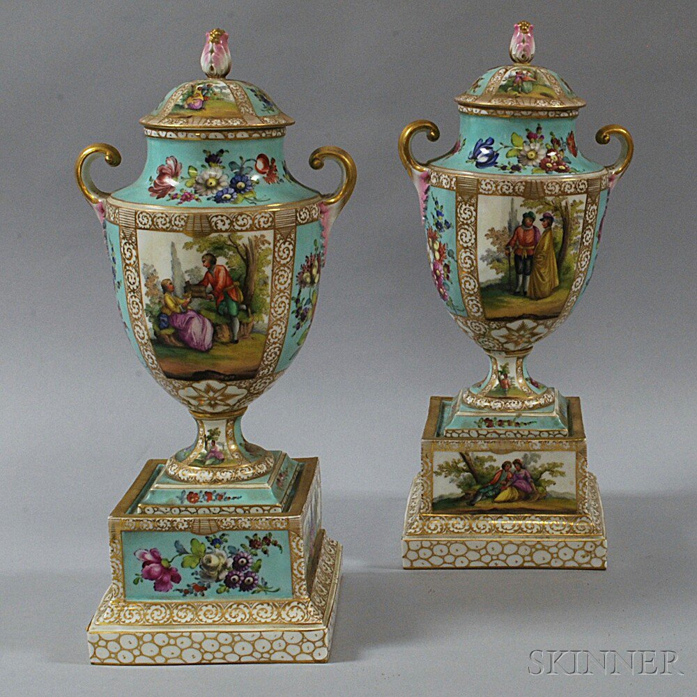 Appraisal: Pair of German Porcelain Covered Urns with Bases th th