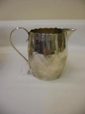 Appraisal: A GEORGE III CREAM JUG of bellied form with lobed