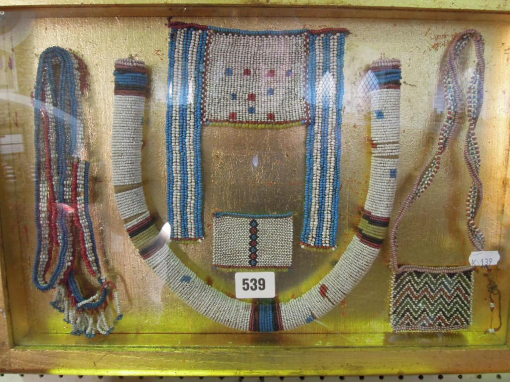 Appraisal: Three framed examples of African bead work mounted in gold