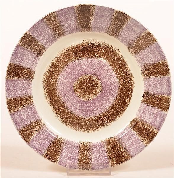 Appraisal: Purple and Brown Rainbow Spatter Toddy Plate Purple and Brown