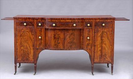 Appraisal: NEW YORK CLASSICAL MAHOGANY SIDEBOARD The bow-front top above a