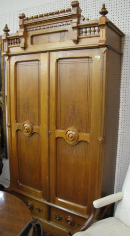 Appraisal: Walnut Eastlake Two Door Armoire with incised carving and burl