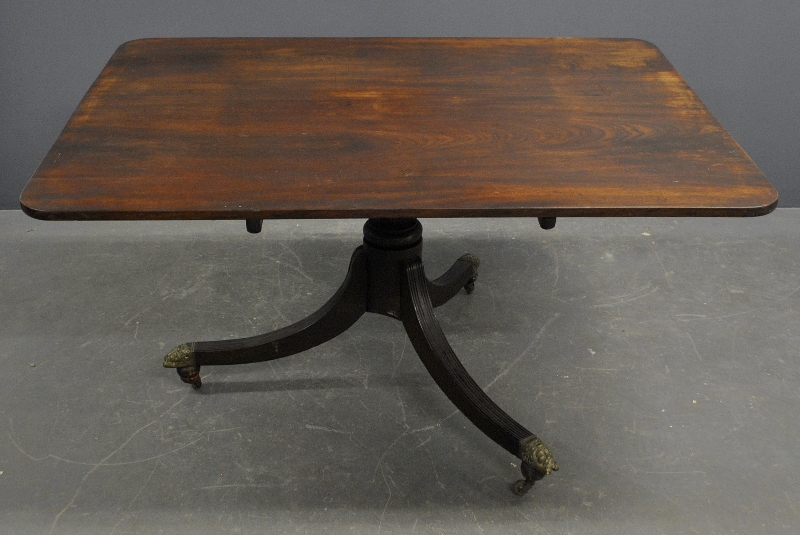 Appraisal: - George III mahogany breakfast table with tilt-top and brass