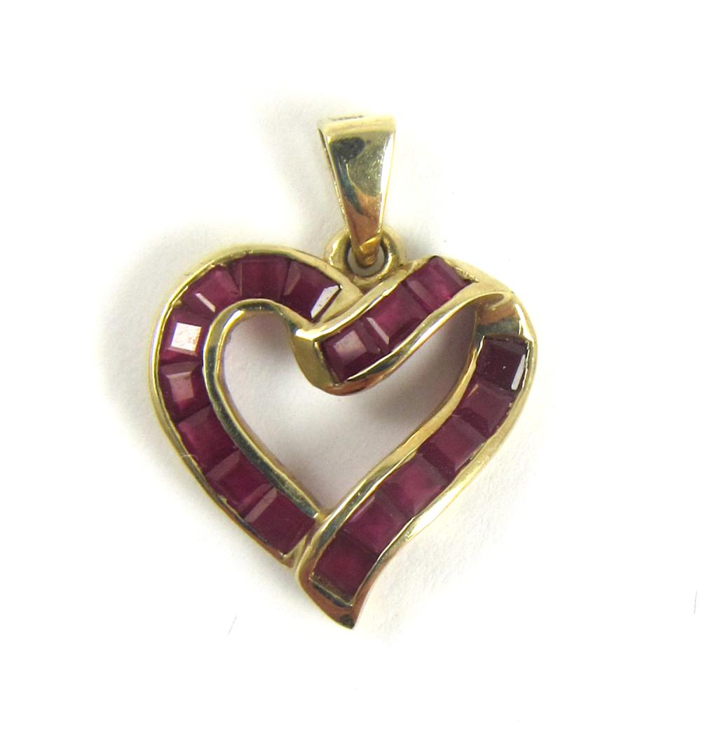 Appraisal: RUBY AND YELLOW GOLD OPEN HEART PENDANT The k yellow