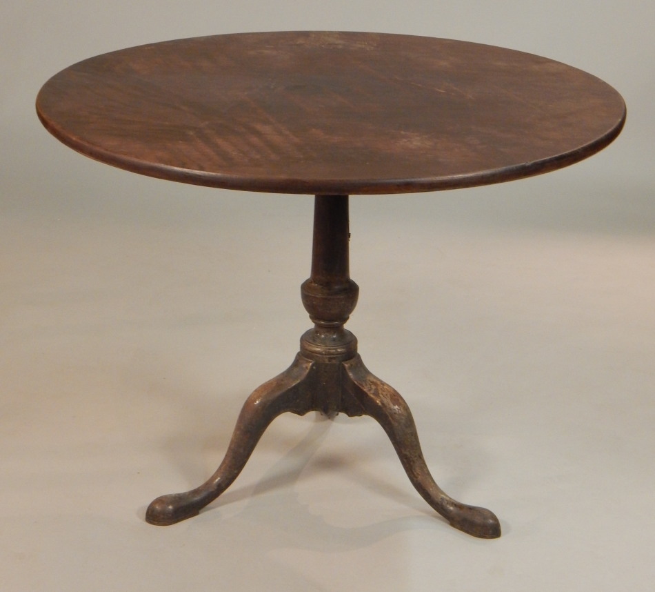 Appraisal: A thC mahogany tilt top table the circular top on