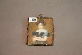 Appraisal: A portrait miniature of a lady holding a book French