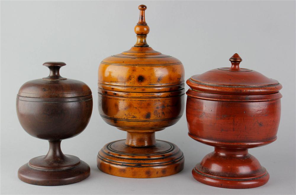 Appraisal: THREE TREEN COVERED CUPS one lignum vitae probably early th