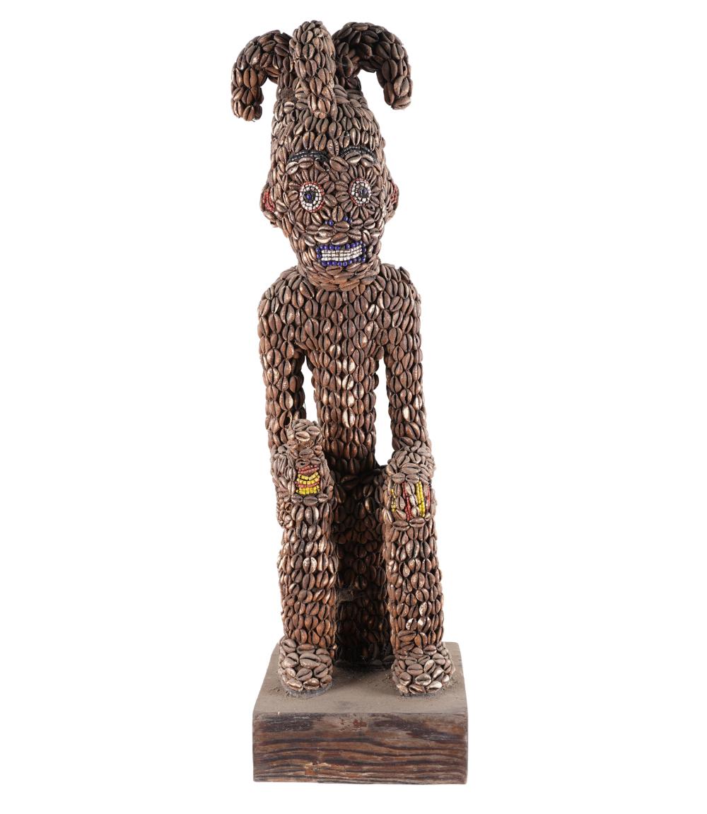 Appraisal: AFRICAN BEADED WOOD FIGUREdepicting a seated man Condition missing shells