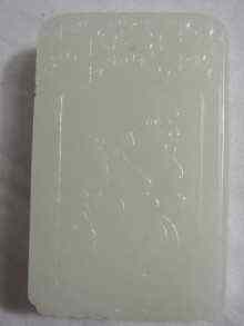 Appraisal: A Chinese white jade rectangular pendant carved in bas relief