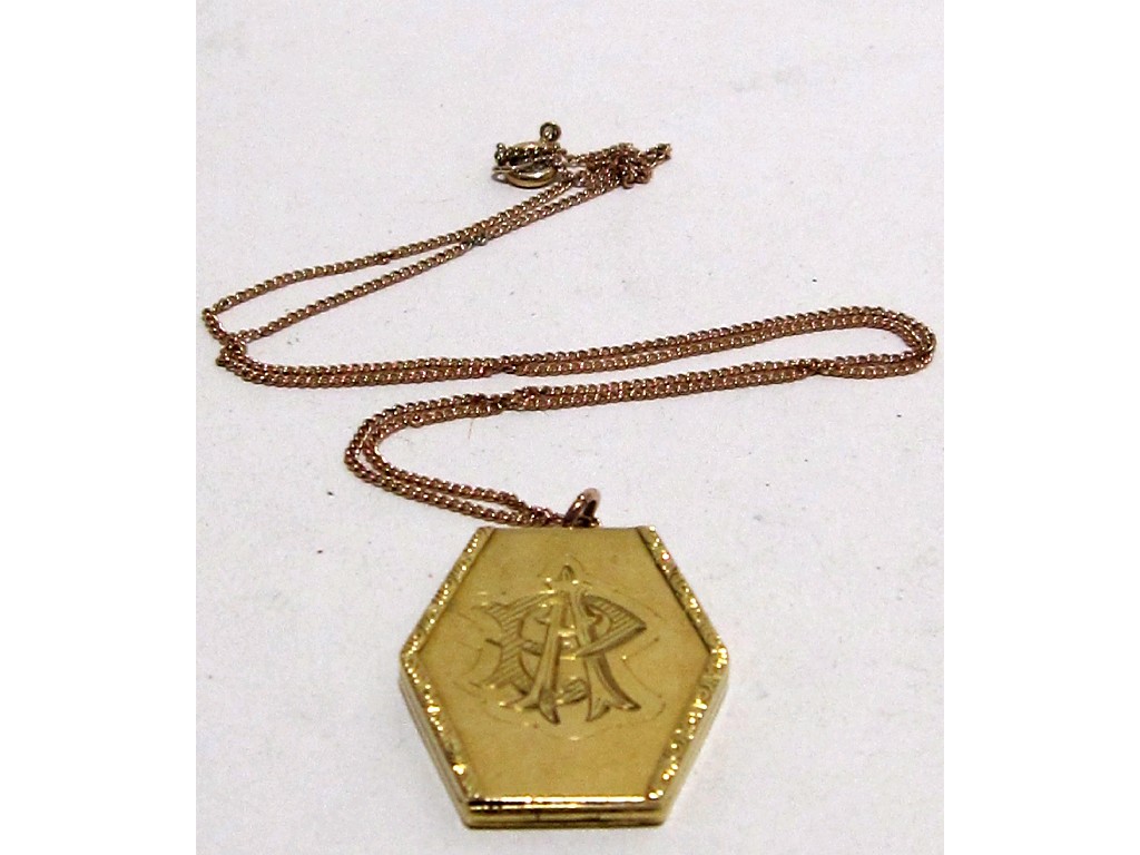 Appraisal: Yellow metal hexagonal shaped photo locket inscribed AR on neckchain