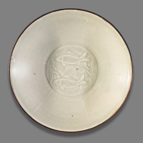 Appraisal: A Dingyao dish with molded decoration Jin Dynasty Its shallow