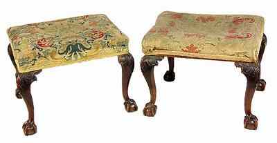 Appraisal: A pair of walnut stools each with upholstered top on