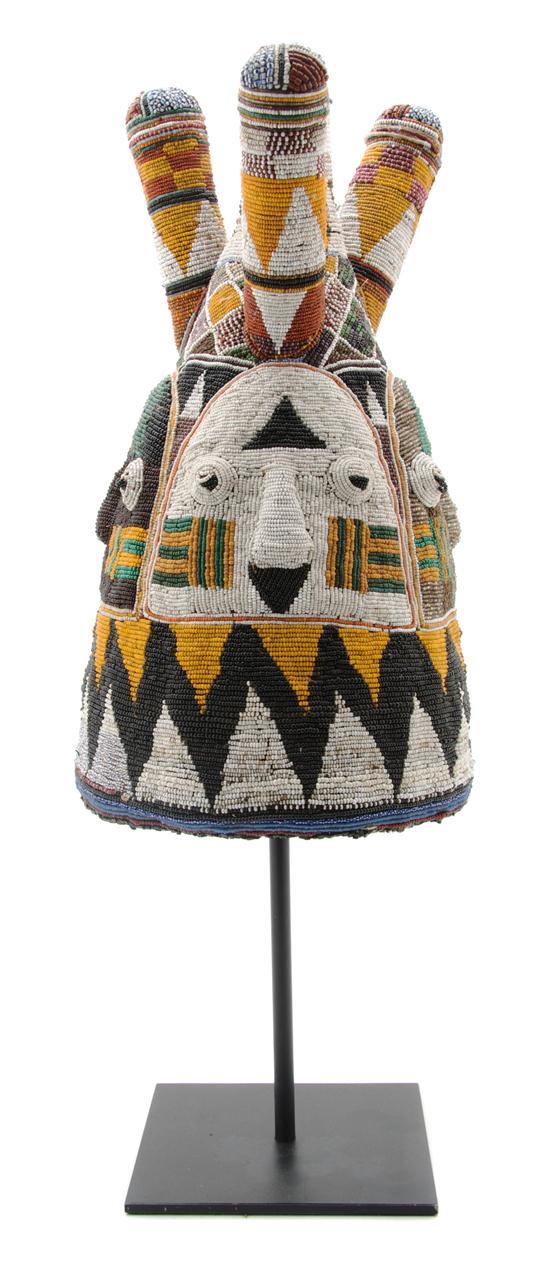 Appraisal: A Yoruba Beaded Ceremonial Headdress of conical form with three