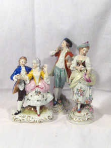 Appraisal: A pair of porcelain statuettes and one other