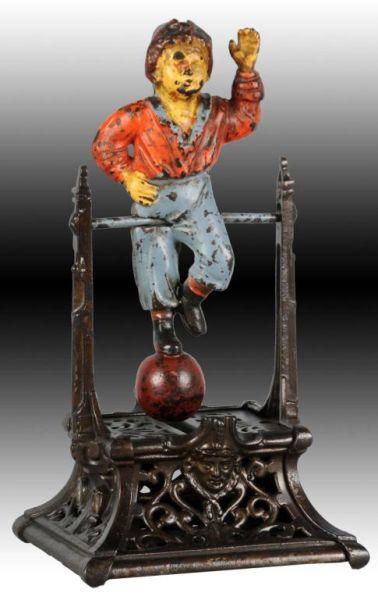 Appraisal: Cast Iron Boy on Trapeze Mechanical Bank Description Manufactured by