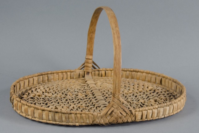 Appraisal: American Indian Oak Splint Gathering Tray BasketWith Eye-of-God handle bracing