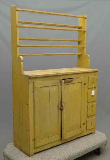 Appraisal: th c open top cupboard having two doors flanked by