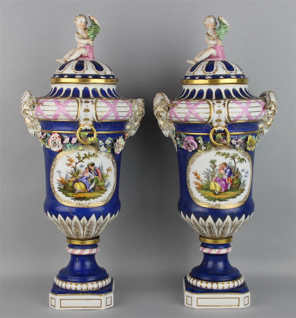 Appraisal: PAIR OF BERLIN PORCELAIN LAPIS GROUND URNS mid to late