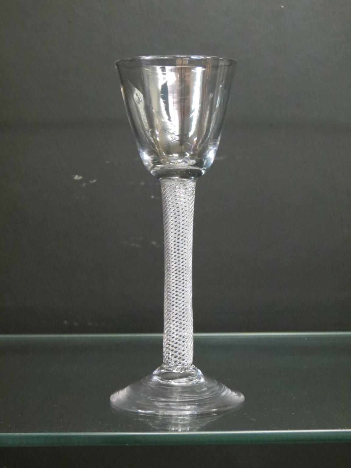 Appraisal: An th century English wine glass round funnel bowl on