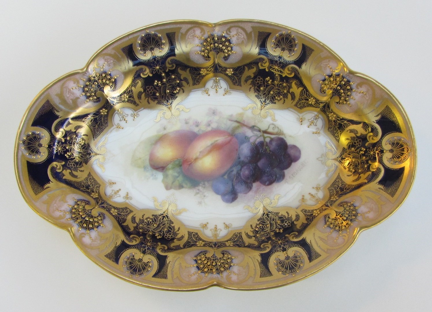 Appraisal: A Royal Worcester lobed oval dessert dish by Richard Sebright